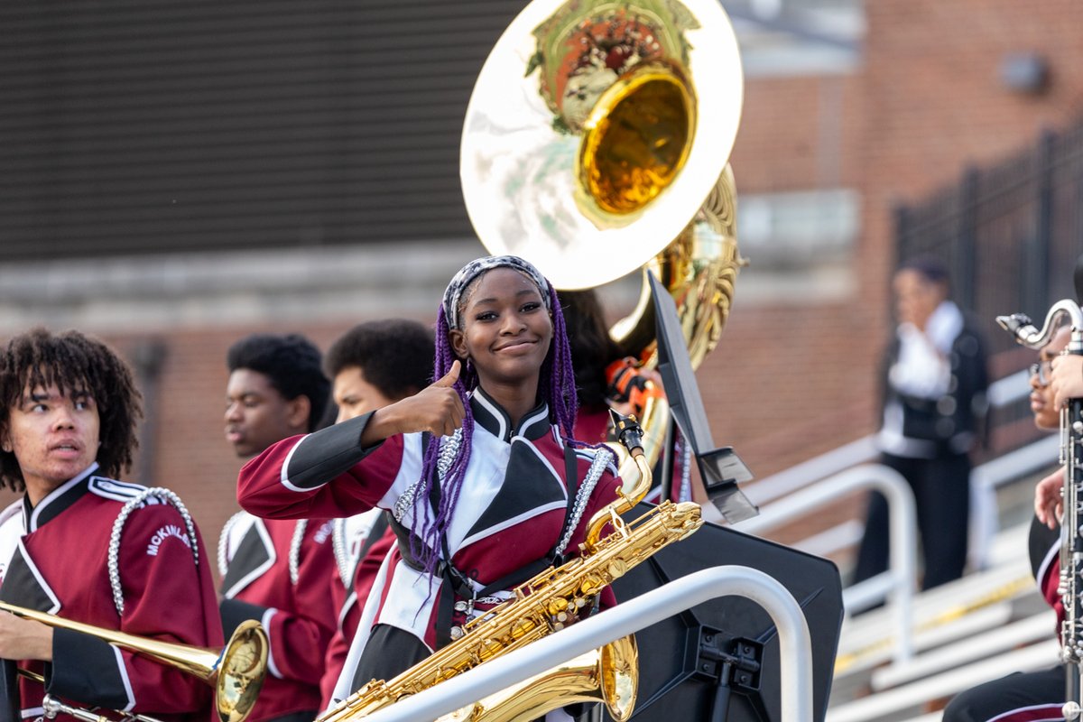 Marching band member playing a sousaphone