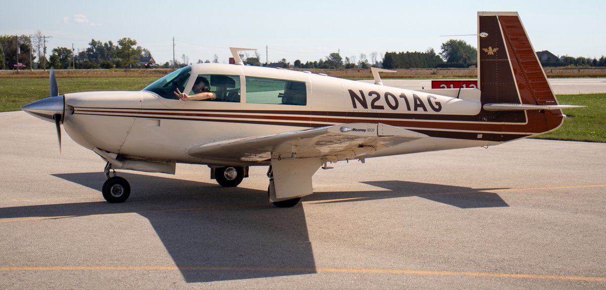 Small airplane parked on the tarmac