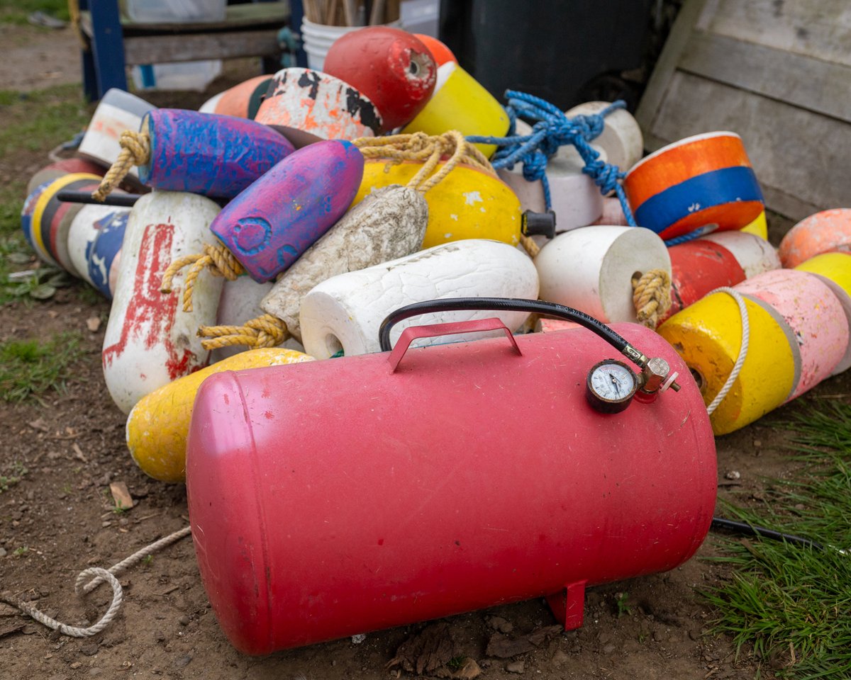 Pile of colorful fishing buoys